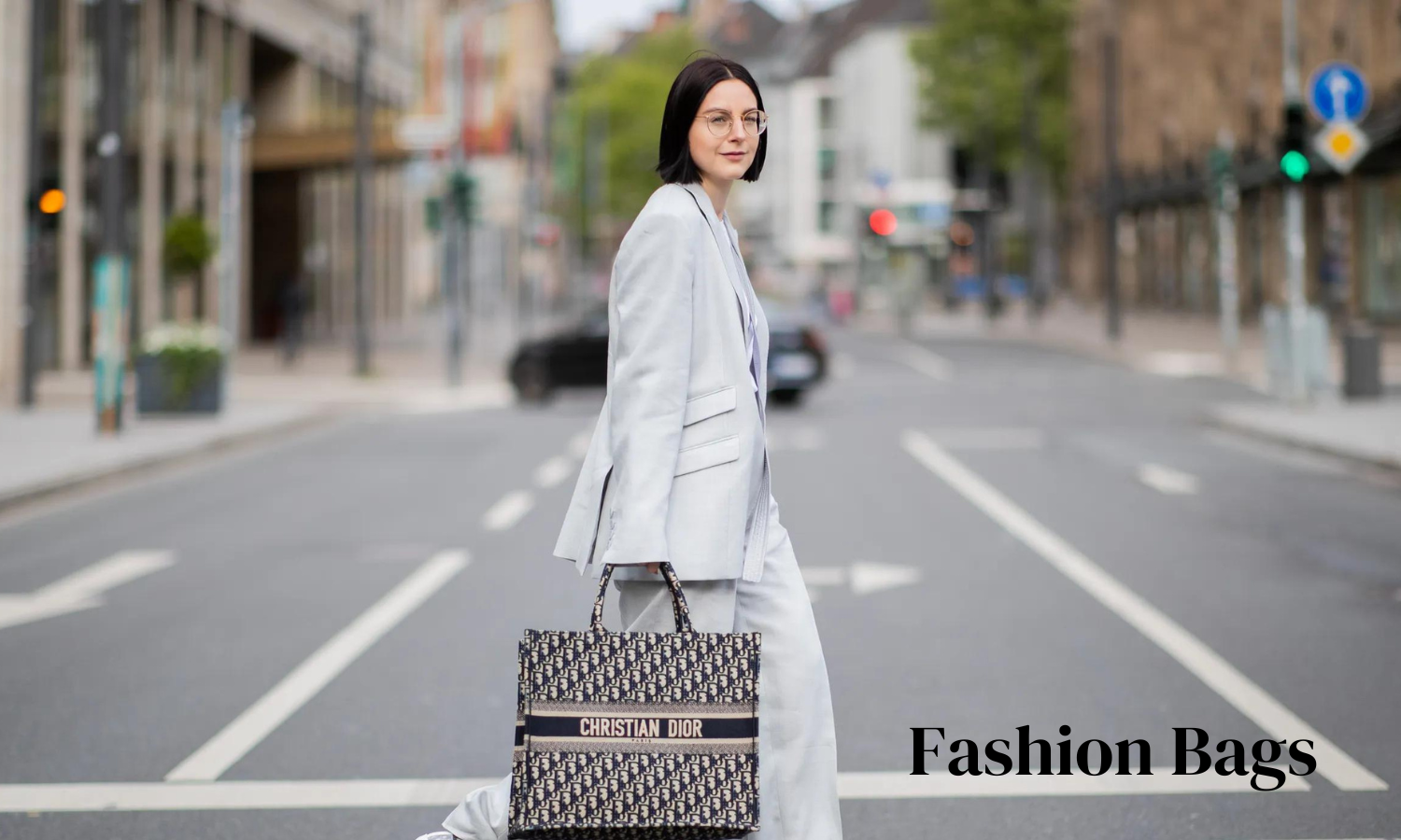 A woman holding a stylish handbag, showcasing the perfect blend of fashion and function