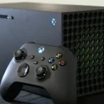 Gamer holding Xbox Series X controller with the console glowing in the background, representing immersive power and speed.